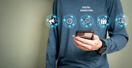 Selective focus at men hand holding smartphone while search or buying online marketplace with icon show digital marketing campaign or online Search Engine Optimization to boost up sales.