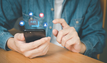 Selective focus at men hand while type on smartphone while chat and communication with friend on online social media platform. Virtual community that people can share or upload photo and content.