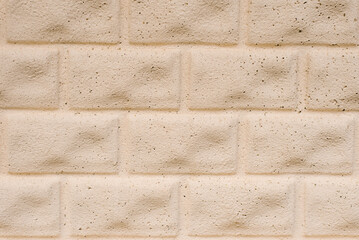 Beige brick construction background for copy space
