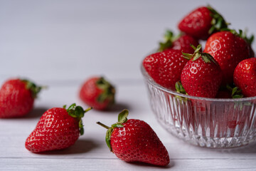 Fresh Organic Strawberries on a white wooden surface