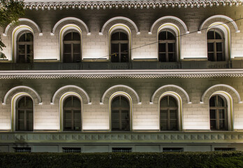 Illuminated window arches on Art Nouveau architecture building in Riga, Latvia