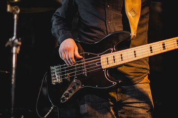 Plakat Man playing five string bass guitar with black shirt