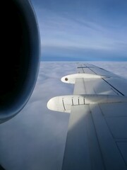 View of engine and wing from an airplane window 