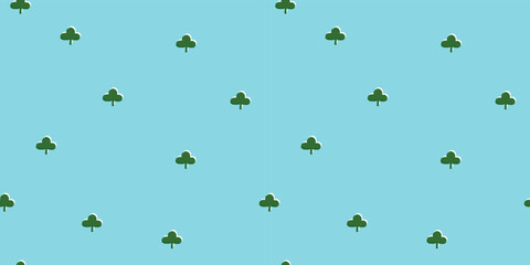 Seamless pattern designed as if a green three-leaf clover was printed on a faded blue background. It can be printed as wrapping paper, background, or wallpaper.