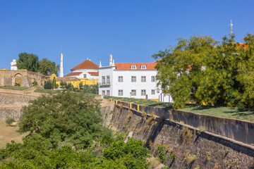Fototapeta na wymiar Historic houses behind the surrounding wall of Elvas, Portugal