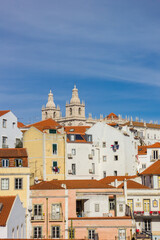 Towers of the Sao Vicente church and traditional houses in Lisbon, Portugal