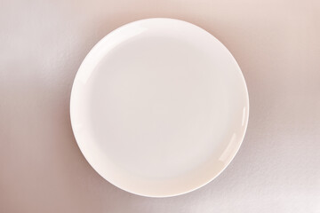 White plate on a gray background. Graphic background for designers.
