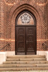 wooden door entrance to the church