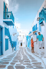 couple on vacation, Mykonos Greece, Little Venice Mykonos Greece, sunset at ocean fron at Mykonos town Europe during summer vacation - obrazy, fototapety, plakaty