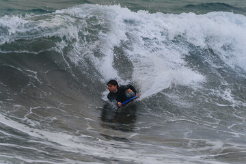 young bodyboarder surfs a wave in Gran Canaria. Canary Islands