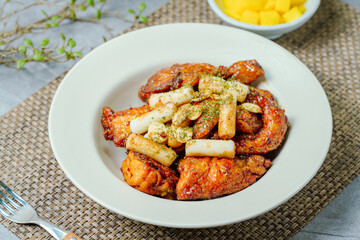 yangnyeom chicken, Korean Seasoned Fried Chicken : This dish is seasoned chicken cut into pieces, deep- fried, and mixed with soy sauce, gochujang, or other sauces. It has a mild yet spicy taste that 