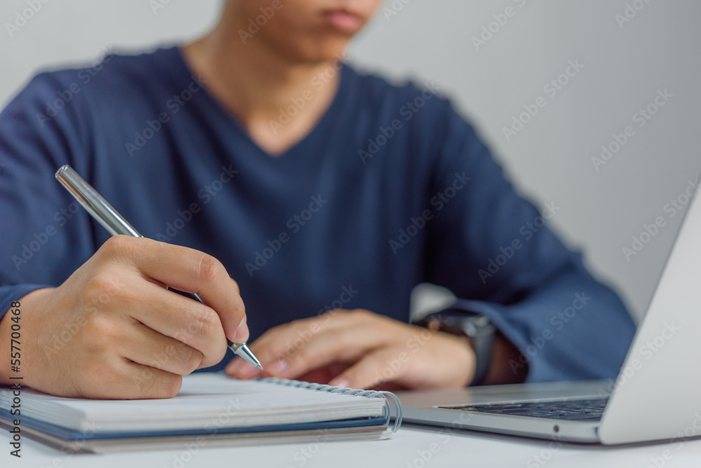 Poster learning online class by using laptop computer and writing notebook at workplace, education developm