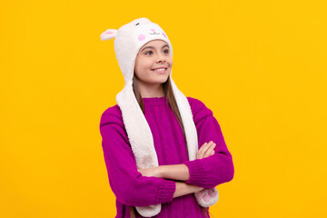 express positive emotion. glad child in earflap hat. kid wear warm clothes