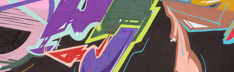 Colorful background of graffiti painting artwork with bright aerosol strips on metal wall. Old school street art piece made with aerosol spray paint cans. Contemporary youth culture backdrop