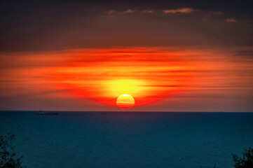 Sunset over Dongtan Beach, south of Pattaya, in Thailand. 