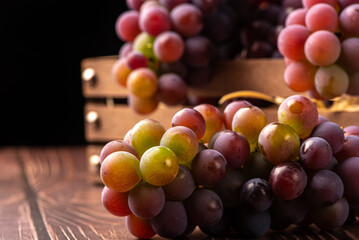 Grapes, details of beautiful grapes on rustic wood, selective focus.
