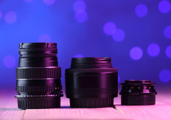 Fototapeta na wymiar three 50mm lenses on table