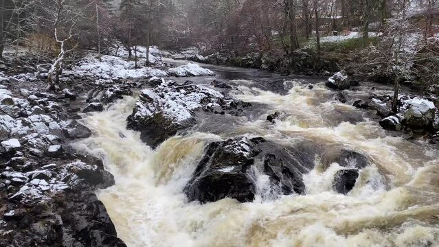 River Dee fast flowing due to high water level during the winter at the Bridge of Feugh