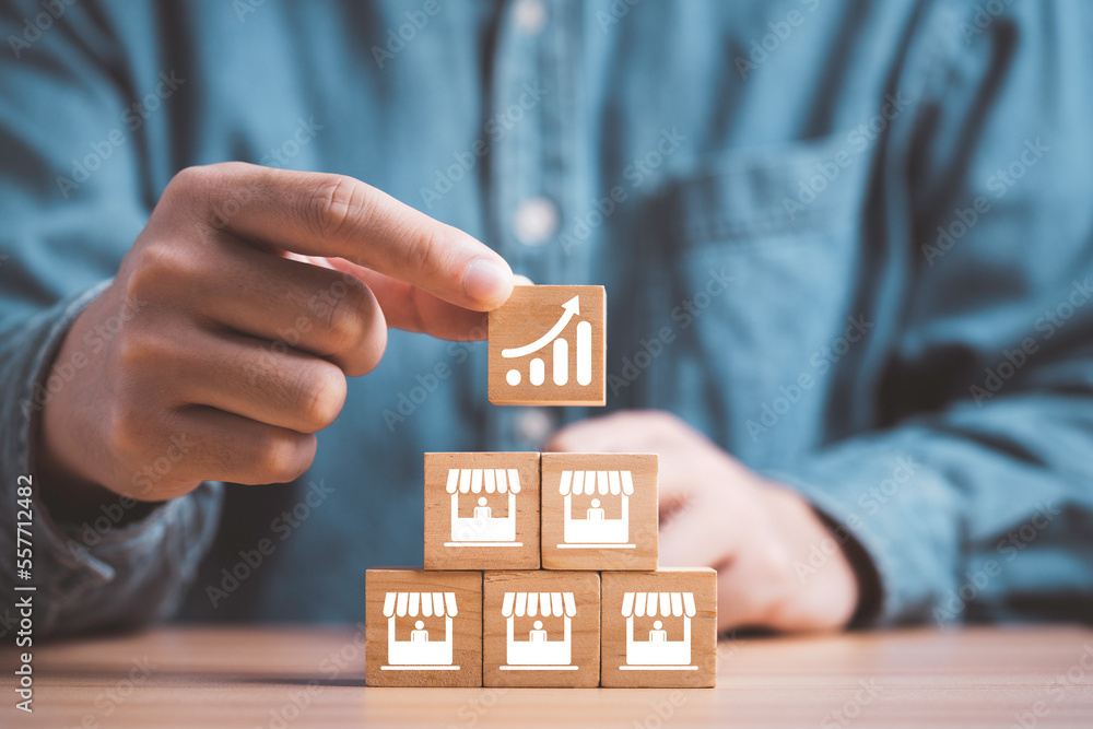 Poster businessman stacking increasing graph on store illustration print screen on wooden cube block for bu