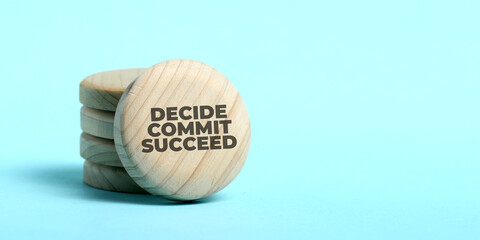 Motivational and inspirational quote wrote on wood. Decide commit succeed.