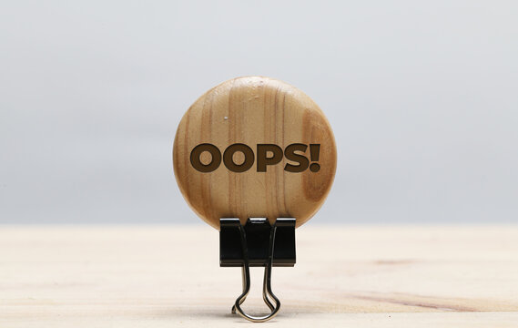 Motivational and inspirational quote wrote on wood. Oops