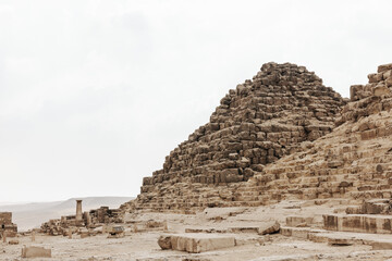 Fototapeta premium Small Pyramid at the eastern cemetery in front of the Pyramids of Giza