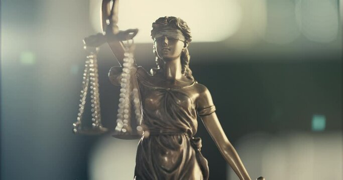 Legal and law concept statue of Lady Justice on blurred background	