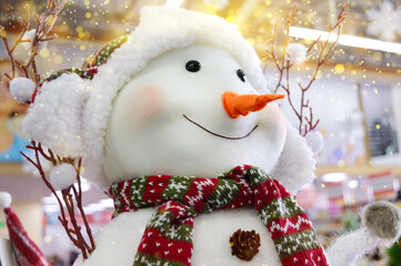 Close-up of a fun toy snowman. The concept of winter holidays.