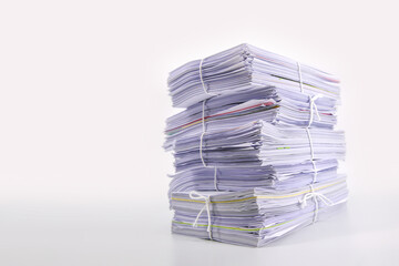 Pile or heap of financial business document paperwork stack on office desk concept of workload overtime or workplace paperless copy