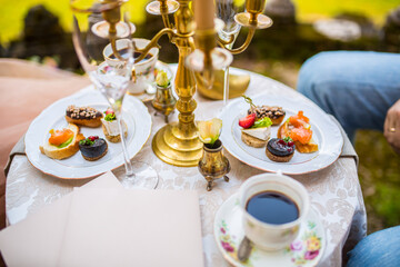 Gourmet snacks on small vintage style table
