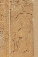 Egyptian hieroglyphs at the Saqqara Necropolis in Egypt.