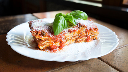 Lasagna is a type of pasta. It is usually served in overlapping sheets interspersed with layers of ingredients to taste, most often meat in bolognese sauce and béchamel.