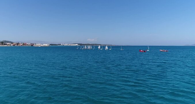 drone timelapse view of small sailboats in the sea