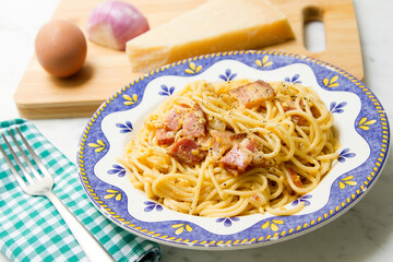 Carbonara pasta. Carbonara is an Italian pasta dish from Rome made with eggs, hard cheese, cured pork, and black pepper.