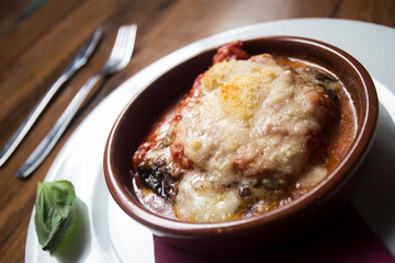 Parmigiana. It's like a lasagna made of aubergines, with grated cheese, tomato sauce and basil leaves.