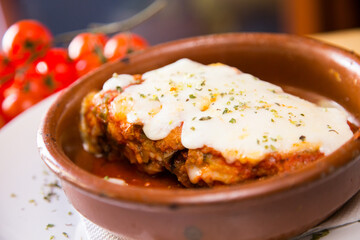 Parmigiana. It's like a lasagna made of aubergines, with grated cheese, tomato sauce and basil leaves.