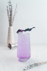 Glass of fresh cocktail with lavender