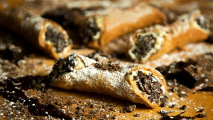 The cannolo is a typical sweet from the Italian region of Sicily, where it originates from. It consists of a rolled dough in the shape of a tube that contains ingredients mixed with ricotta.