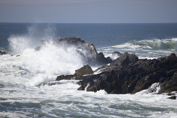 Ocean waves crashing against a rocky shore