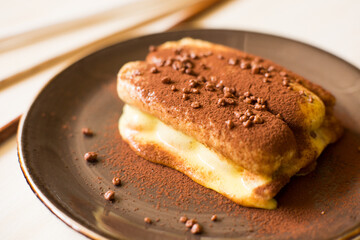 Italian tiramisu. Tiramisu is a cold cake that is assembled in layers. and has ingredients like cocoa, mascarpone and coffee.