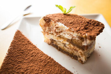Italian tiramisu. Tiramisu is a cold cake that is assembled in layers. and has ingredients like cocoa, mascarpone and coffee.
