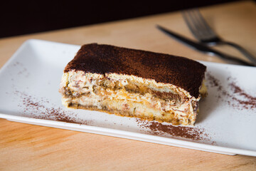 Italian tiramisu. Tiramisu is a cold cake that is assembled in layers. and has ingredients like cocoa, mascarpone and coffee.