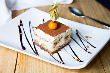 Italian tiramisu. Tiramisu is a cold cake that is assembled in layers. and has ingredients like cocoa, mascarpone and coffee.