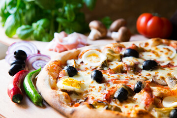 Serrano ham pizza. Neapolitan pizza made with baked vegetables and serrano ham. Italian recipe.