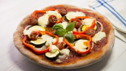 Pizza with vegetables. Neapolitan pizza made with baked vegetables. Italian vegetarian recipe.