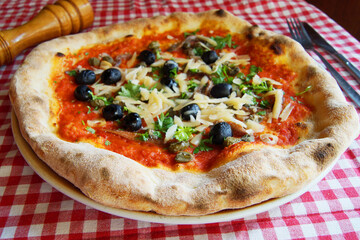 Pizza with vegetables. Neapolitan pizza made with baked vegetables. Italian vegetarian recipe.