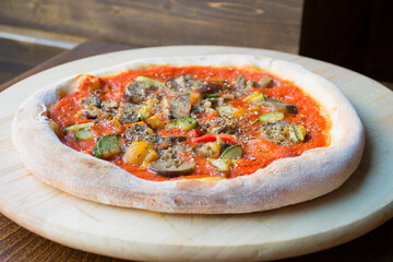 Pizza with vegetables. Neapolitan pizza made with baked vegetables. Italian vegetarian recipe.