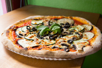 Pizza with vegetables. Neapolitan pizza made with baked vegetables. Italian vegetarian recipe.