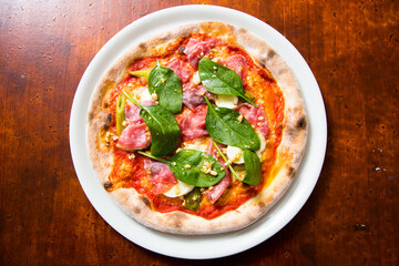 Pizza beef carpaccio. Neapolitan pizza made with tomato sauce, cheese and beef. Italian recipe.