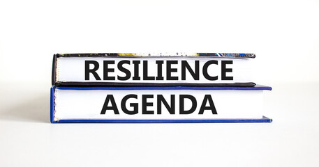 Resilience agenda symbol. Concept word Resilience agenda typed on books. Beautiful white table white background. Business and resilience agenda concept. Copy space.